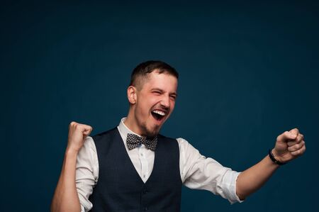 Happy young male student in formal clothesの写真素材