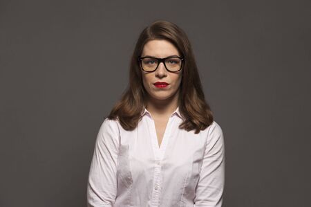 Young woman with glasses and red lipsの写真素材