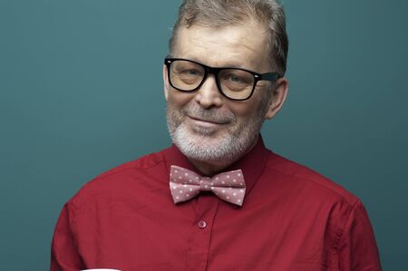 Portrait of a positive elderly man in glassesの写真素材