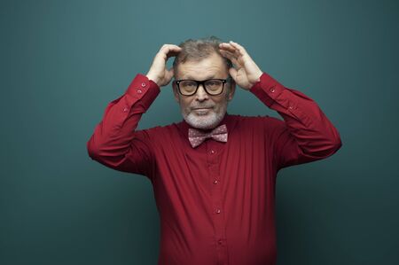 Portrait of a positive elderly man in glassesの写真素材