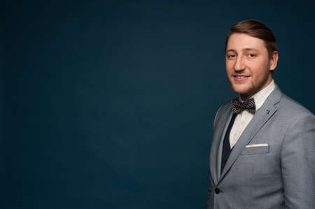 Handsome positive man in elegant formal clothesの写真素材