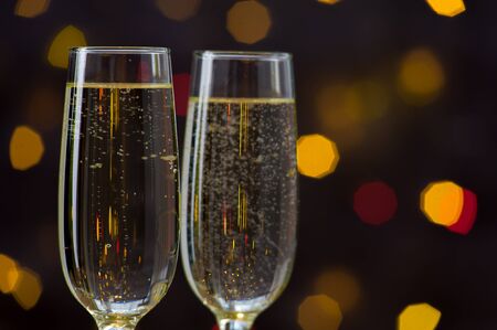 Close-up of two glasses with bubbly champagneの写真素材