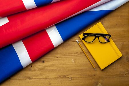 Top view of flag of Great Britain lies on tableの写真素材