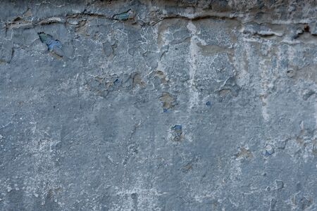 Close-up - gray stone wall in the old facade of the houseの写真素材