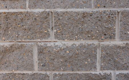 Grey brick wall. Block background, design pattern