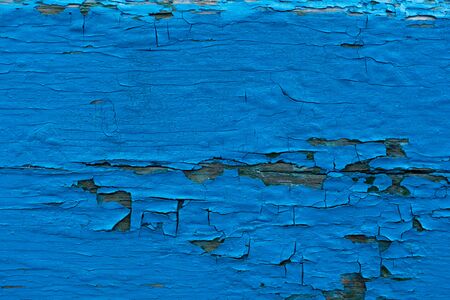 Pattern of wooden old wall. Horizontal pattern of wooden grunge blue wall with scratches, cracks and peeling paintの写真素材