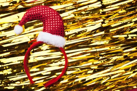 Funny Christmas headband on golden tinsel backgroundの写真素材