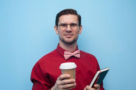 Portrait of smiling handsome young man in glassesの写真素材
