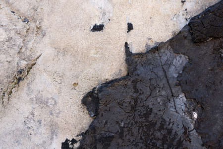Close-up - gray-brown stone wall in the old facade of the house - background imageの写真素材
