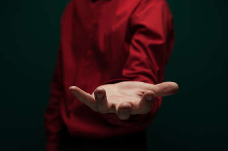 Man holding an invisible object on palmの写真素材