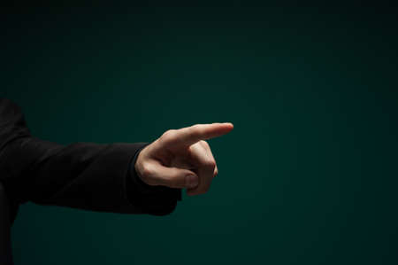Mans hand clicks on an invisible touchpadの写真素材