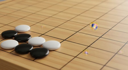 Go game with black and white stones on a wooden board, close-upの素材