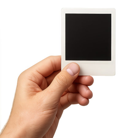 Hand holding blank photo frame isolated on white background. Clipping pathの素材