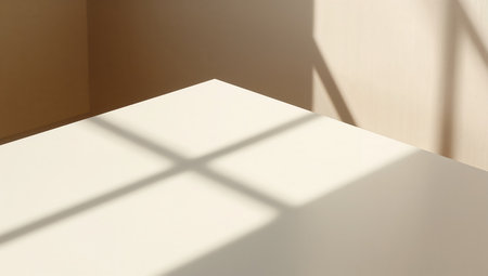 White table and shadow on the wall. Sunlight from window.の素材