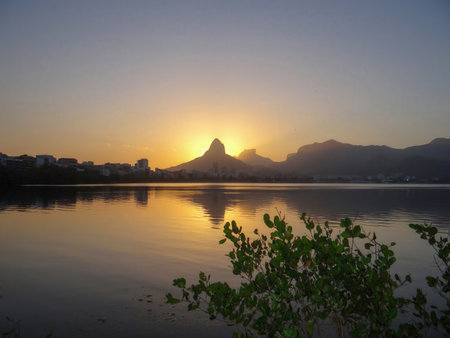 Sunset at the lake with mountains in the background, Rio de Janeiro, Brazilの写真素材