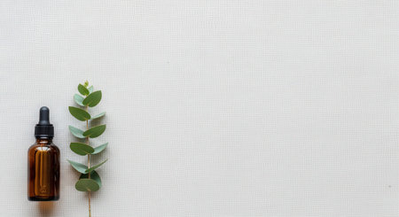Essential oil with eucalyptus branch on white backgroundの素材