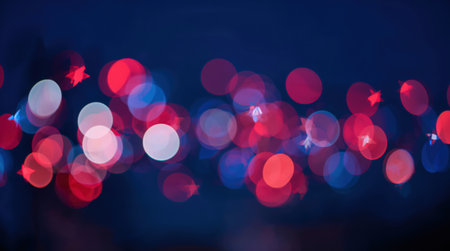 a blurred abstract background with red, white, and blue lights creating a festive and dreamy atmosphereの素材