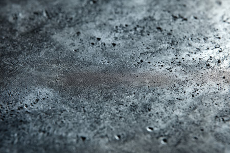 abstract background texture of a dark gray concrete wall with cracks and scratchesの素材