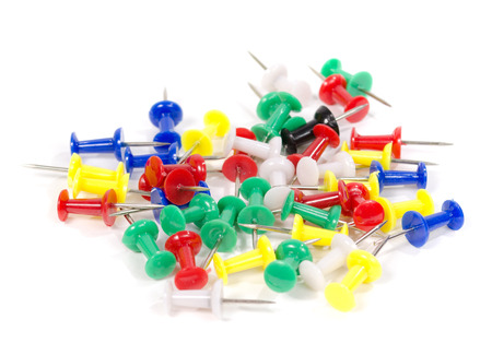 Colorful thumbtacks. Red thumbtack closeup.