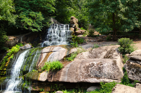 Big waterfall on the rocks on a sunny day. Ukraine, Uman.の写真素材