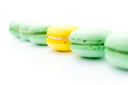 French colorful macaroons on a white background (green, yellow)の写真素材