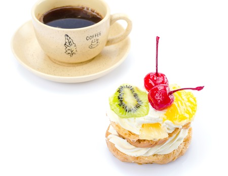 Brewing cake with colorful fruits and coffee