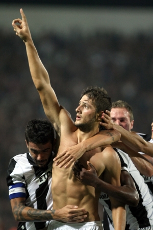 THESSALONIKI,GREECE-AUG 23, 2012 :PAOK Katsikas (C) celebrates after scoring a goal against Rapid during the UEFA Europa League soccer match at Toumba stadium のeditorial素材