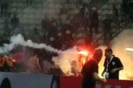THESSALONIKI, GREECE-AUG 23, 2012:Clashes PAOK Thessaloniki and Rapid Vienna fans and the police before UEFA Europe League Playoff Football Match at Toumba Stadium のeditorial素材