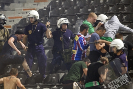 THESSALONIKI, GREECE-AUG 23, 2012:Clashes PAOK Thessaloniki and Rapid Vienna fans and the police before UEFA Europe League Playoff Football Match at Toumba Stadium のeditorial素材