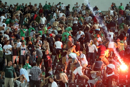 THESSALONIKI, GREECE-AUG 23, 2012:Clashes PAOK Thessaloniki and Rapid Vienna fans and the police before UEFA Europe League Playoff Football Match at Toumba Stadium のeditorial素材