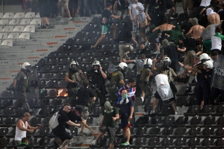 THESSALONIKI, GREECE-AUG 23, 2012:Clashes PAOK Thessaloniki and Rapid Vienna fans and the police before UEFA Europe League Playoff Football Match at Toumba Stadium のeditorial素材