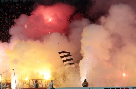 THESSALONIKI, GREECE - FEB 5, 2012: Fans and supporters of PAOK team light flares in football match...