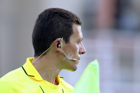KOMOTINI,GREECE-SEPT 15, 2012: Assistant referees Iordanis Dimitriadis in action during the soccer match between Panthrakikos and Panathinaikos at Komotini stadium のeditorial素材