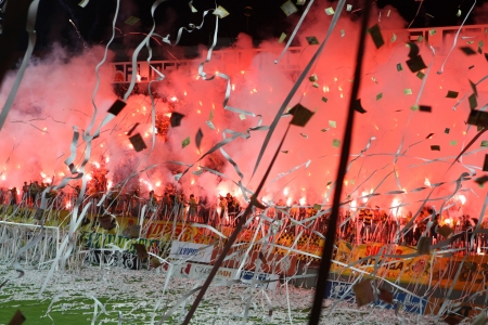THESSALONIKI, GREECE - AUGUST 5, 2009: Fans and supporters of Aris team light flares in football match between Aris and Boca Juniors cheering for their team goals のeditorial素材