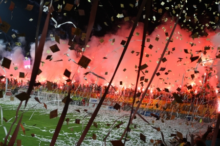 THESSALONIKI, GREECE - AUGUST 5, 2009: Fans and supporters of Aris team light flares in football match between Aris and Boca Juniors cheering for their team goals のeditorial素材