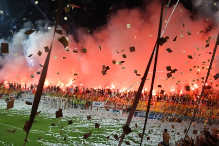 THESSALONIKI, GREECE - AUGUST 5, 2009: Fans and supporters of Aris team light flares in football match between Aris and Boca Juniors cheering for their team goals のeditorial素材