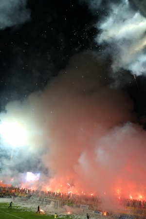 THESSALONIKI, GREECE - AUGUST 5, 2009: Fans and supporters of Aris team light flares in football match between Aris and Boca Juniors cheering for their team goals のeditorial素材