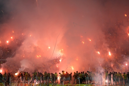 THESSALONIKI, GREECE - AUGUST 5, 2009: Fans and supporters of Aris team light flares in football match between Aris and Boca Juniors cheering for their team goals のeditorial素材