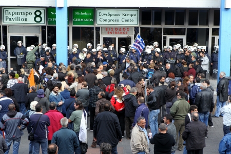 THESSALONIKI,GREECE - NOV,15 2012: Municipal workers gesture during a demonstration against the presence of a German deputy labour minister Hans-Joachim Fuchtel, in Thessaloniki on 15 November, 2012 のeditorial素材