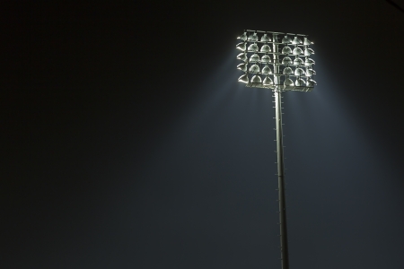 Stadium lights against dark night sky backgroundon の写真素材