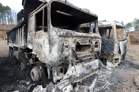 HALKIDIKI,GREECE-FEB,17,2013:Group of 40 men threw molotov cocktails and set fire to equipment at the Hellenic Gold site, damaging containers, cars and trucks, in the northern region of Halkidiki のeditorial素材