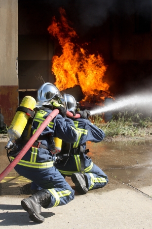 THESSALONIKI, GREECE - APRIL 19:Firefighter fighting For A Fire Attack, During A Training Exercise for the consequences earthquake in Industrial Area of Sindos on April 19,2013 in Thessaloniki, Greeceのeditorial素材