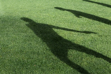 Silhouettes soccer players on the field turfの写真素材