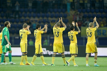 KHARKIV, UKRAINE -AUG 07:Players of METALIST are cheering after the UEFA Champions League soccer match METALIST vs PAOK at Metalist Arena on August 07,2013 in Kharkiv, Ukraine.のeditorial素材
