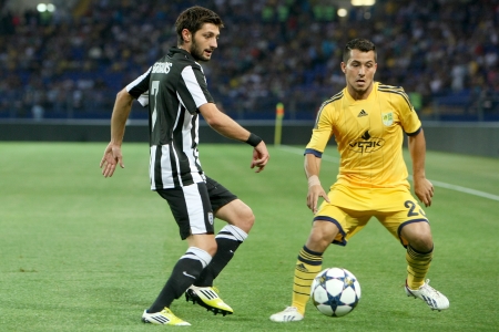 KHARKIV, UKRAINE -AUG 07:Georgiadis of PAOK (L) in action with Blanco of METALIST (R) during the UEFA Champions League soccer match METALIST vs PAOK at Metalist Arena on August 07,2013 in Kharkiv, Ukraine.のeditorial素材