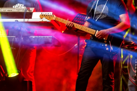 Entertainment concert lighting and guitar performer on backgroundの写真素材
