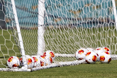 THESSALONIKI, GREECE - SEPT 19 : Europa League balls in net during Paok training on September 19, 2013 in Thessaloniki, Greece. のeditorial素材