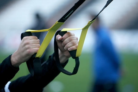 Close up on hands doing suspension training