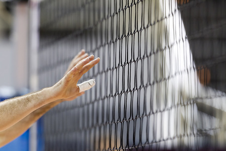 THESSALONIKI, GREECE  - FEBRUARY 15, 2014 :  Hands on net during the Hellenic Volleyball League game...