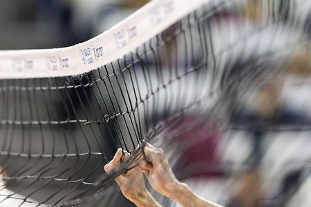 THESSALONIKI, GREECE  - FEBRUARY 15, 2014 :  Hands on net during the Hellenic Volleyball League game Paok vs Olympiacos at PAOK Sports Arena. Shallow dof.のeditorial素材
